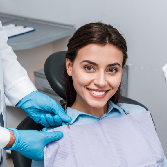 Brunette woman smiling in the dental chair