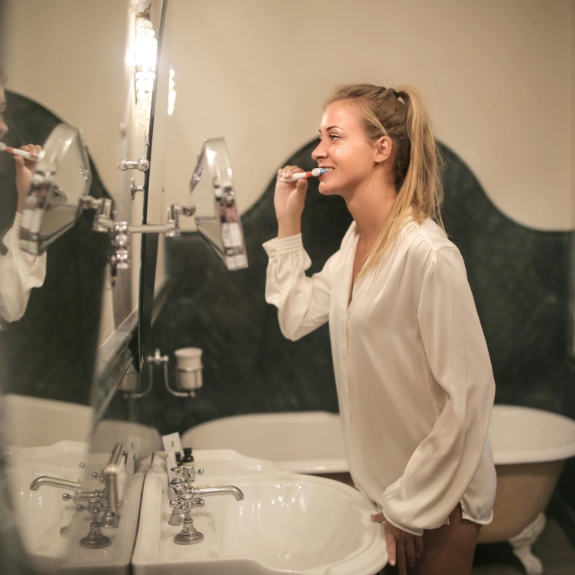 Woman brushing her teeth