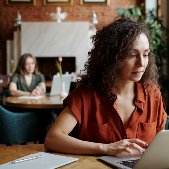 Woman using her laptop at a table