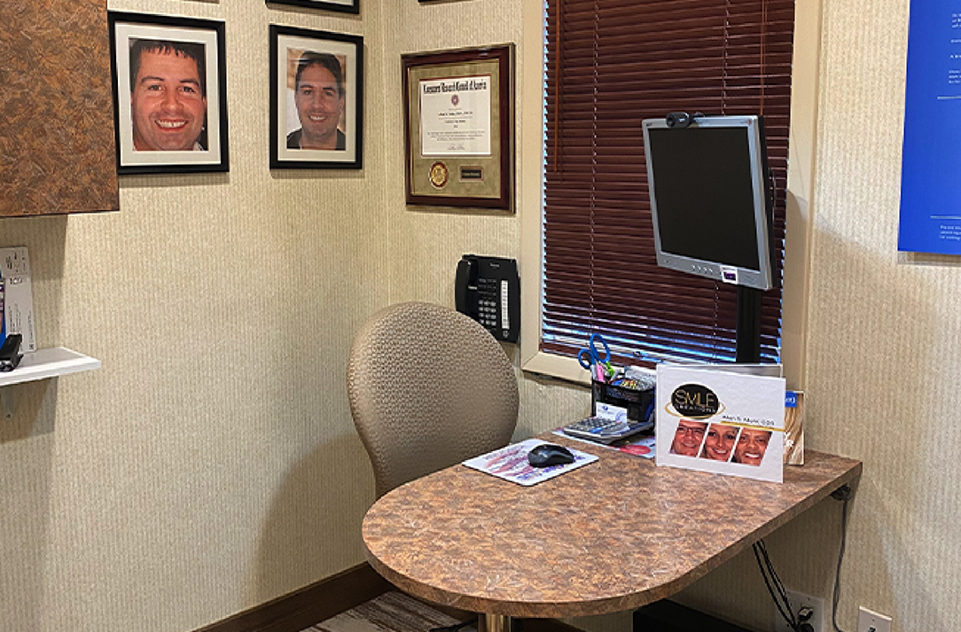 Close up of a desk and a computer in a consultation room