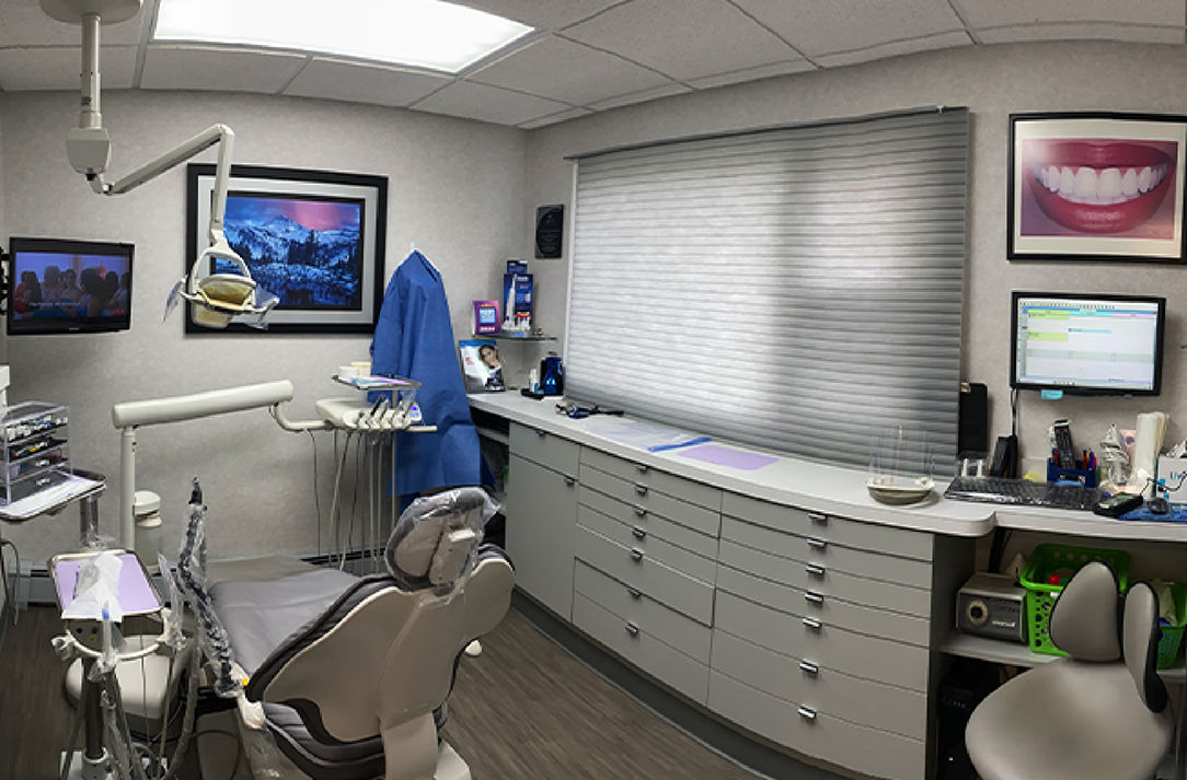 Dental treatment room with gray blinds closed