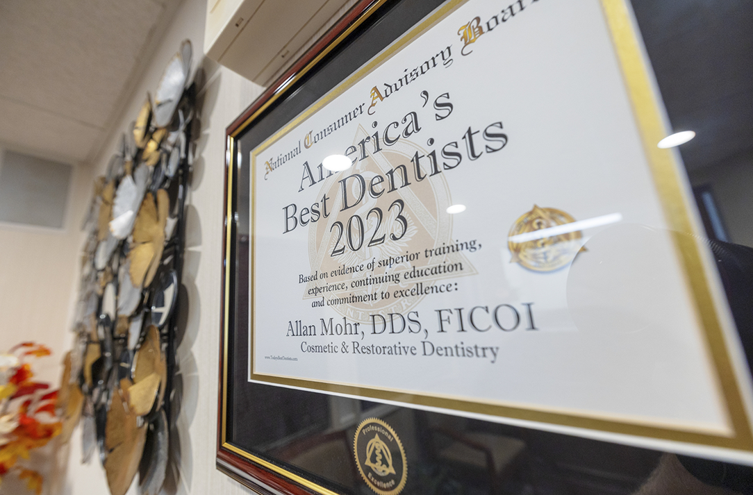 Framed Americas Best Dentist 2023 award on the wall