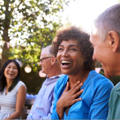 Woman laughing with friends