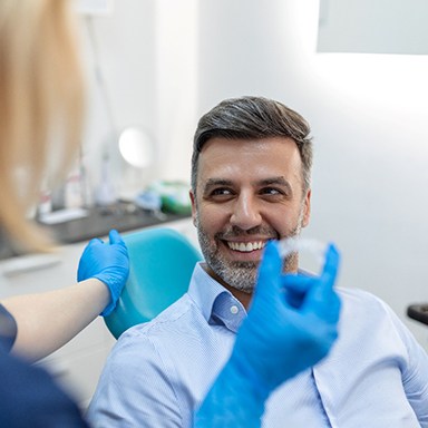 male dental patient receiving Invisalign 
