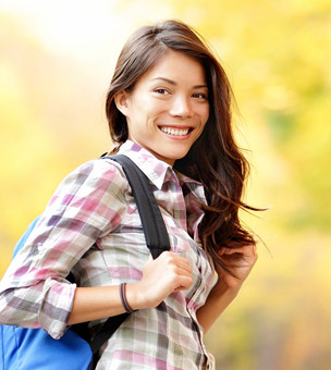 Woman with back pack smiling