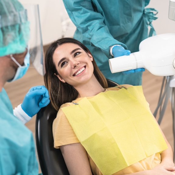 Young woman in the dental chair smiling at her sedation dentist