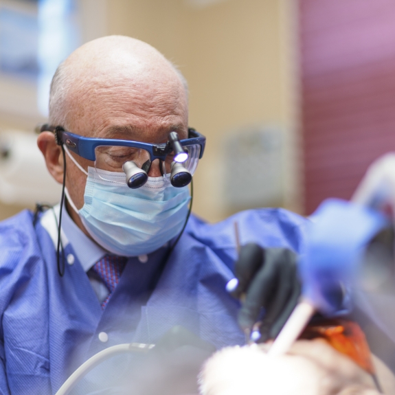Doctor Mohr examining a patient's mouth